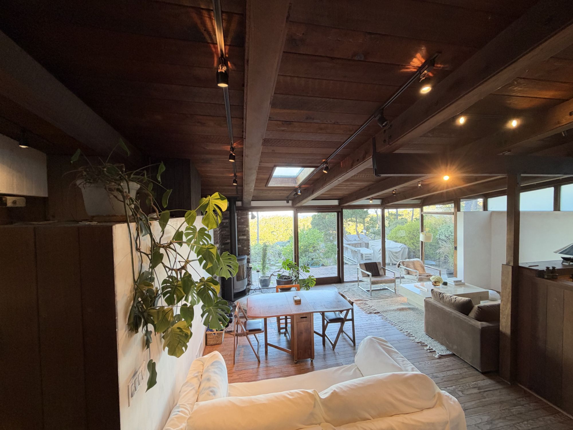 Great room with walls of glass looking out to the ocean